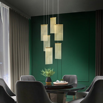 Gold and frosted glass pendant cluster in a green dining room — Mirodemi