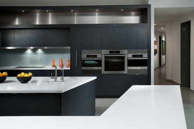 Inspiration for a large contemporary ceramic tile kitchen remodel with flat-panel cabinets, gray cabinets and stainless steel appliances