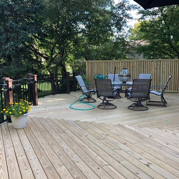 Spacious Wrap Around Wood Deck by Downers Grove, IL Deck Builder.