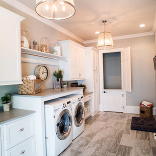 Photo of a large traditional utility room in Atlanta with plywood flooring and grey walls.