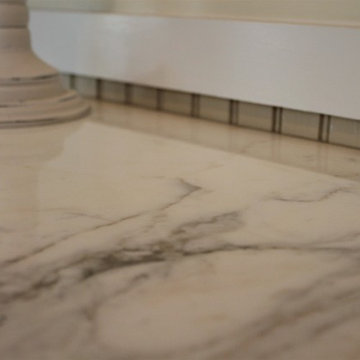 Little Eden Powder Room, Calcutta Gold Marble Countertops, Remodel