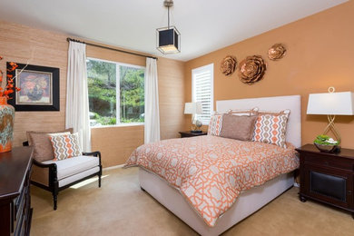 Design ideas for a mid-sized transitional master bedroom in Los Angeles with orange walls, carpet, no fireplace and brown floor.
