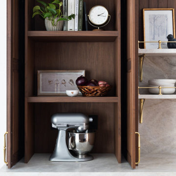 Luxury Transitional Kitchen with Walnut Cabinetry, Marble Slab Backsplash & Bras