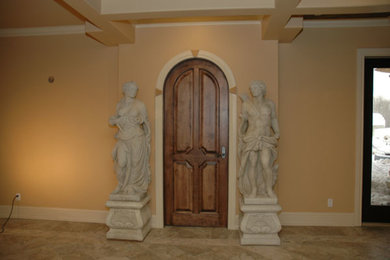 Hallway - large mediterranean hallway idea in Edmonton with beige walls