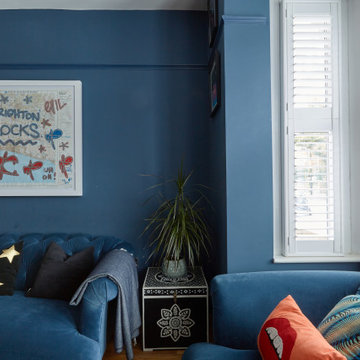Blue colour drenched maximalist lounge