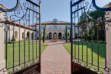 Example of a tuscan exterior home design in Dallas
