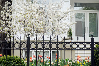 Design ideas for a mid-sized traditional partial sun front yard garden path in Chicago for spring.
