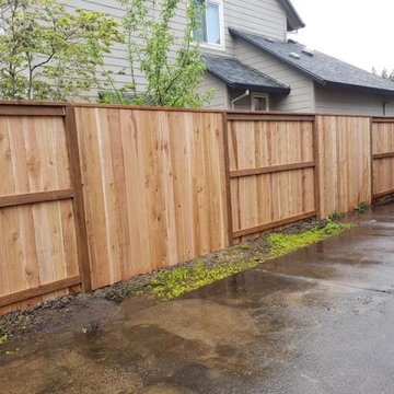 Solid Privacy Fence with Alternating Sections