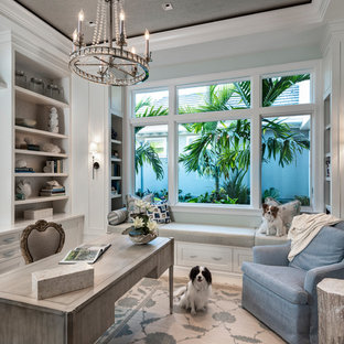Photo of a mid-sized transitional study room in Other with blue walls, a freestanding desk, ceramic floors and white floor.