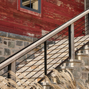 Antique Red Barnwood Paneling and Weathered Antique Rail on Farmhouse Staircase
