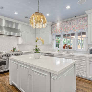 Bright and Elegant Kitchen with Glass Dining Table and Custom Cabinetry