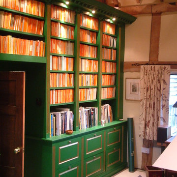 Gilded and painted library over several rooms in a converted 11th century barn
