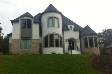 Inspiration for a rustic white two-story mixed siding exterior home remodel in Birmingham