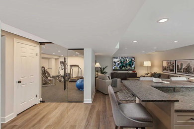 Basement - large contemporary underground medium tone wood floor and brown floor basement idea in Detroit with gray walls
