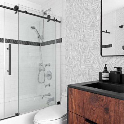 Small trendy 3/4 white tile and subway tile ceramic tile, black floor, single-sink and wallpaper bathroom photo in New York with flat-panel cabinets, medium tone wood cabinets, a one-piece toilet, white walls, an integrated sink, concrete countertops, black countertops and a freestanding vanity