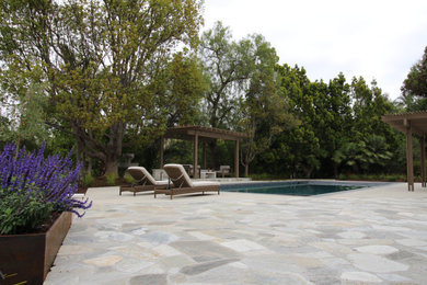 Example of a tuscan backyard pool design in San Diego