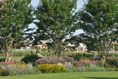 Design ideas for a large traditional partial sun backyard landscaping in New York.