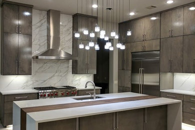 Eat-in kitchen - large contemporary galley porcelain tile and white floor eat-in kitchen idea in Austin with an undermount sink, flat-panel cabinets, gray cabinets, granite countertops, white backsplash, stone slab backsplash, stainless steel appliances and an island