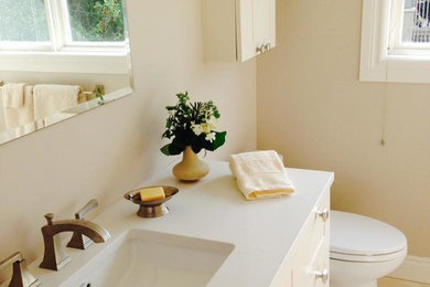 Mid-sized trendy master beige tile and porcelain tile porcelain tile walk-in shower photo in Ottawa with shaker cabinets, white cabinets, a one-piece toilet, beige walls, an undermount sink and quartz countertops