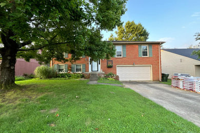 Example of a mid-sized brown two-story house exterior design in Other with a shingle roof and a gray roof