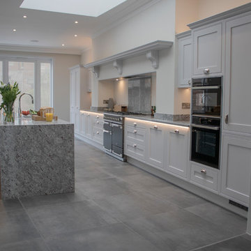 Dove grey kitchen with granite surfaces in Victorian townhouse