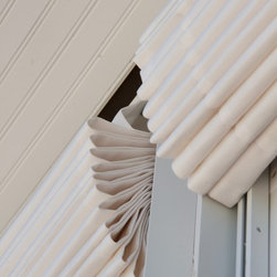 Outdoor shades form nice valence. - Roman Shades