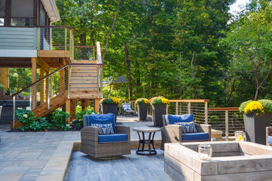 Patio kitchen - mid-sized modern backyard concrete paver patio kitchen idea in Indianapolis
