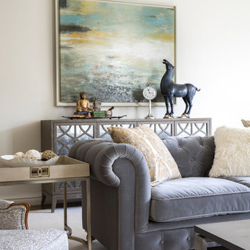 Layered Living Room with Carved Wood Fireplace and Tufted Seating