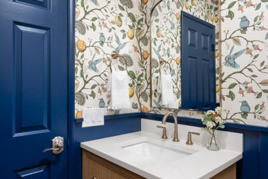 Inspiration for a small transitional light wood floor powder room remodel in Orange County with flat-panel cabinets, light wood cabinets, a drop-in sink, quartz countertops and white countertops