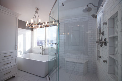 Inspiration for a mid-sized transitional master bathroom in Indianapolis with a freestanding tub, a corner shower, white tile, grey walls, ceramic floors, white floor, a hinged shower door and subway tile.