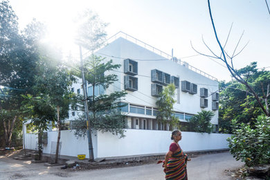 Example of a trendy home design design in Bengaluru