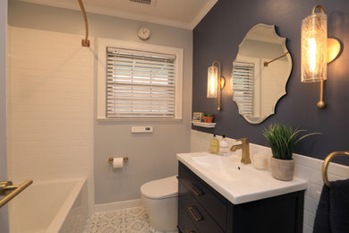 Small transitional white tile and porcelain tile ceramic tile and multicolored floor bathroom photo in Houston with flat-panel cabinets, blue cabinets, a one-piece toilet, blue walls, an integrated sink, solid surface countertops and white countertops