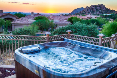 Design ideas for a mid-sized southwestern full sun backyard stone water fountain landscape in Phoenix.