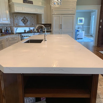 Calacatta Quartz;largest quartz island installed with no seam at more than 11 ft