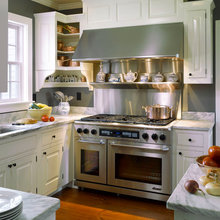 Kitchen hoods w/backsplash behind stove