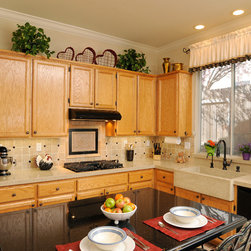 Corian Granola Kitchen with Tile Backsplash and Custom Farmhouse SInk - Products