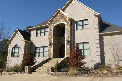 Large transitional beige two-story mixed siding gable roof idea in Little Rock