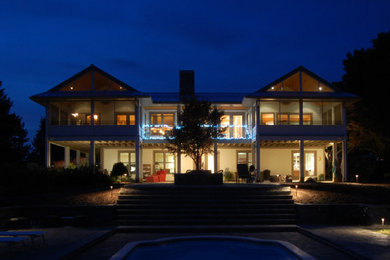 Mid-sized mountain style beige two-story concrete fiberboard gable roof photo in Raleigh