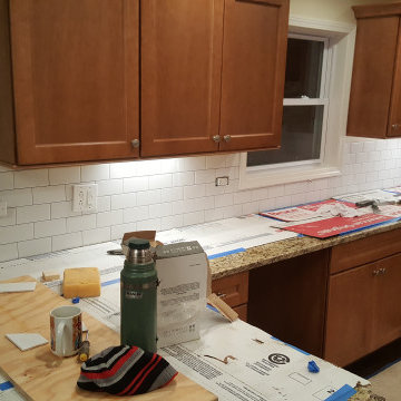 Installing a subway tile backsplash in a new kitchen