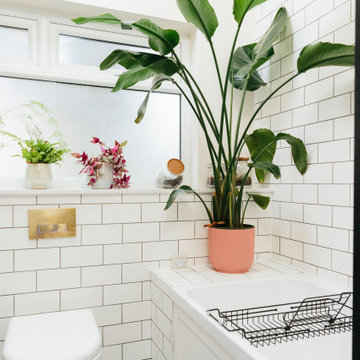 Pink & green bathroom with mix of tiles & patterns