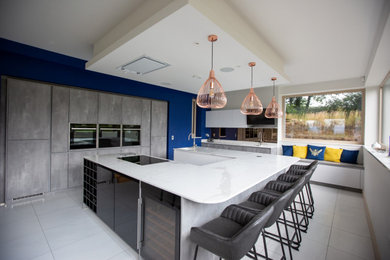 This is an example of a large modern kitchen in Other.