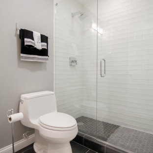 Photo of a medium sized modern look-out basement in Chicago with grey walls, carpet, no fireplace and grey floors.