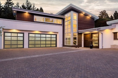 Minimalist three-car garage photo in Atlanta