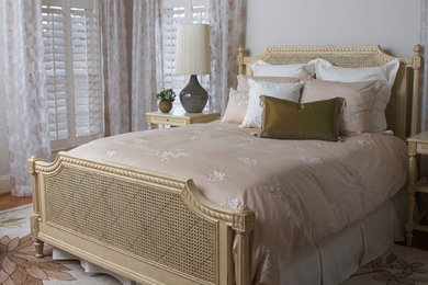 Mid-sized elegant guest light wood floor bedroom photo in Atlanta with white walls