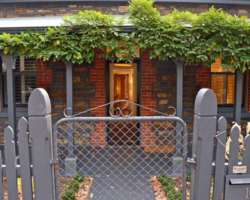 Eclectic Porch Adelaide Inspiration for an eclectic front door remodel in Adelaide with a single front door and a