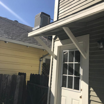 Support of the overhang, siding and exterior trim dry rot repair.