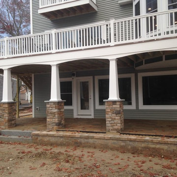 Lakeside patio with stone column bases