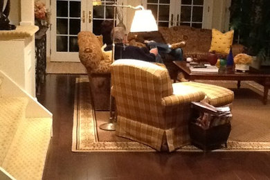 Inspiration for a mid-sized timeless enclosed dark wood floor family room remodel in New York