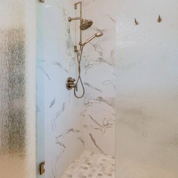 Modern Shower with Frosted Glass Door and Marble Tiles