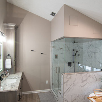 Traditional Master Bathroom With Warm Tones, Stand Alone Tub & Walk In Shower